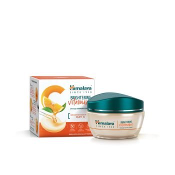 Himalaya Brightening Vitamin C Orange Serum-Infused Cream 50 g jar with fresh orange slices