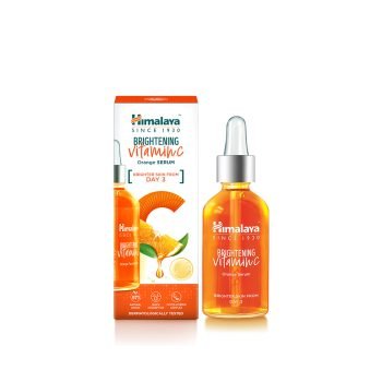 Himalaya Brightening Vitamin C Orange Serum 30 ml bottle with fresh orange slices